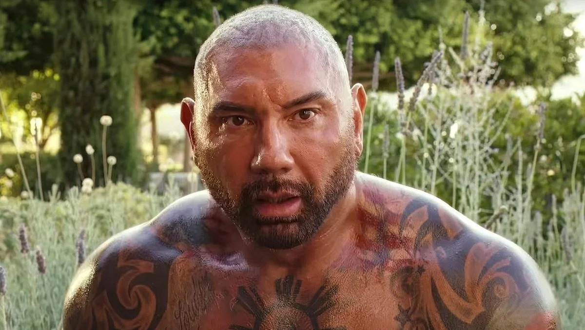 Dave Bautista’s chest and arm tattoos, including heritage imagery visible in a Glass Onion still