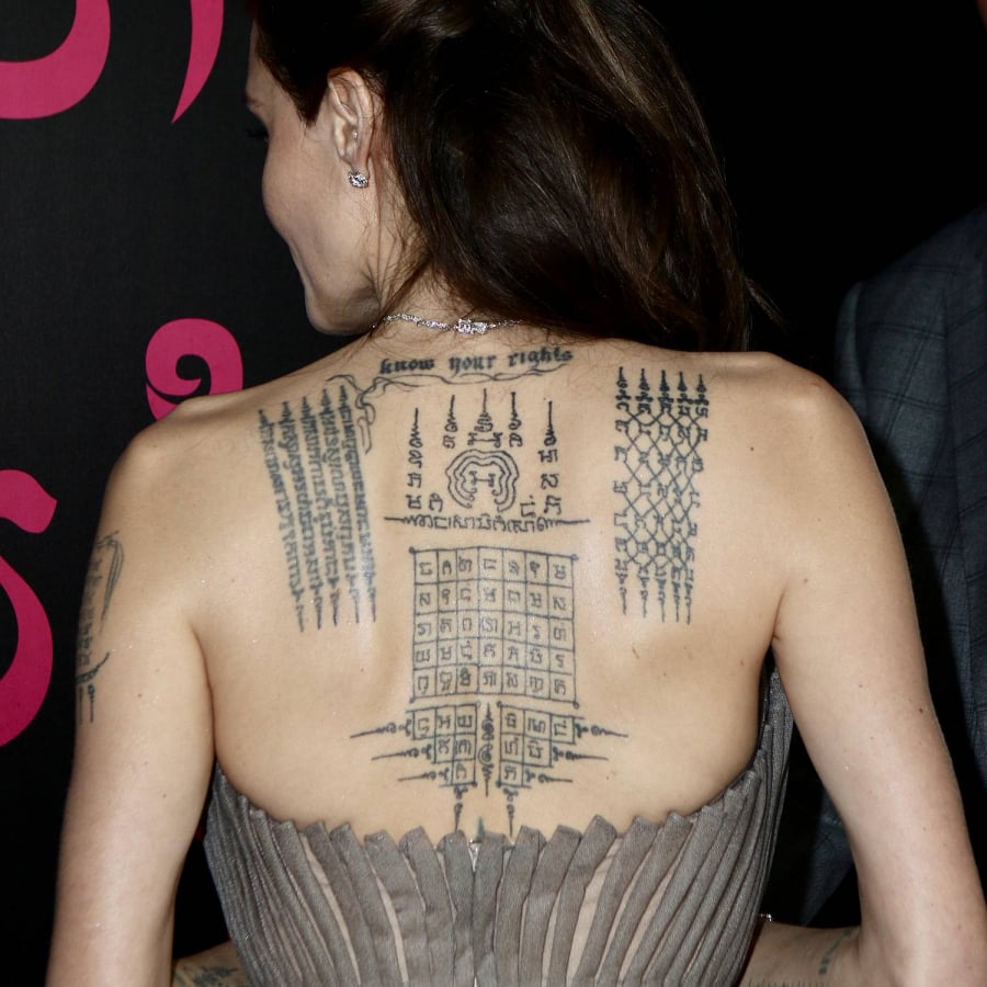 Angelina Jolie’s Cambodian Sak Yant tattoos across her upper back