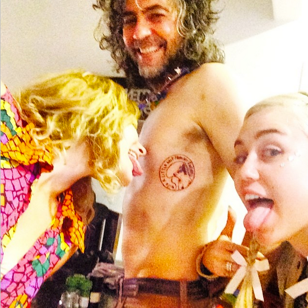 Miley Cyrus and Wayne Coyne matching chest tattoo