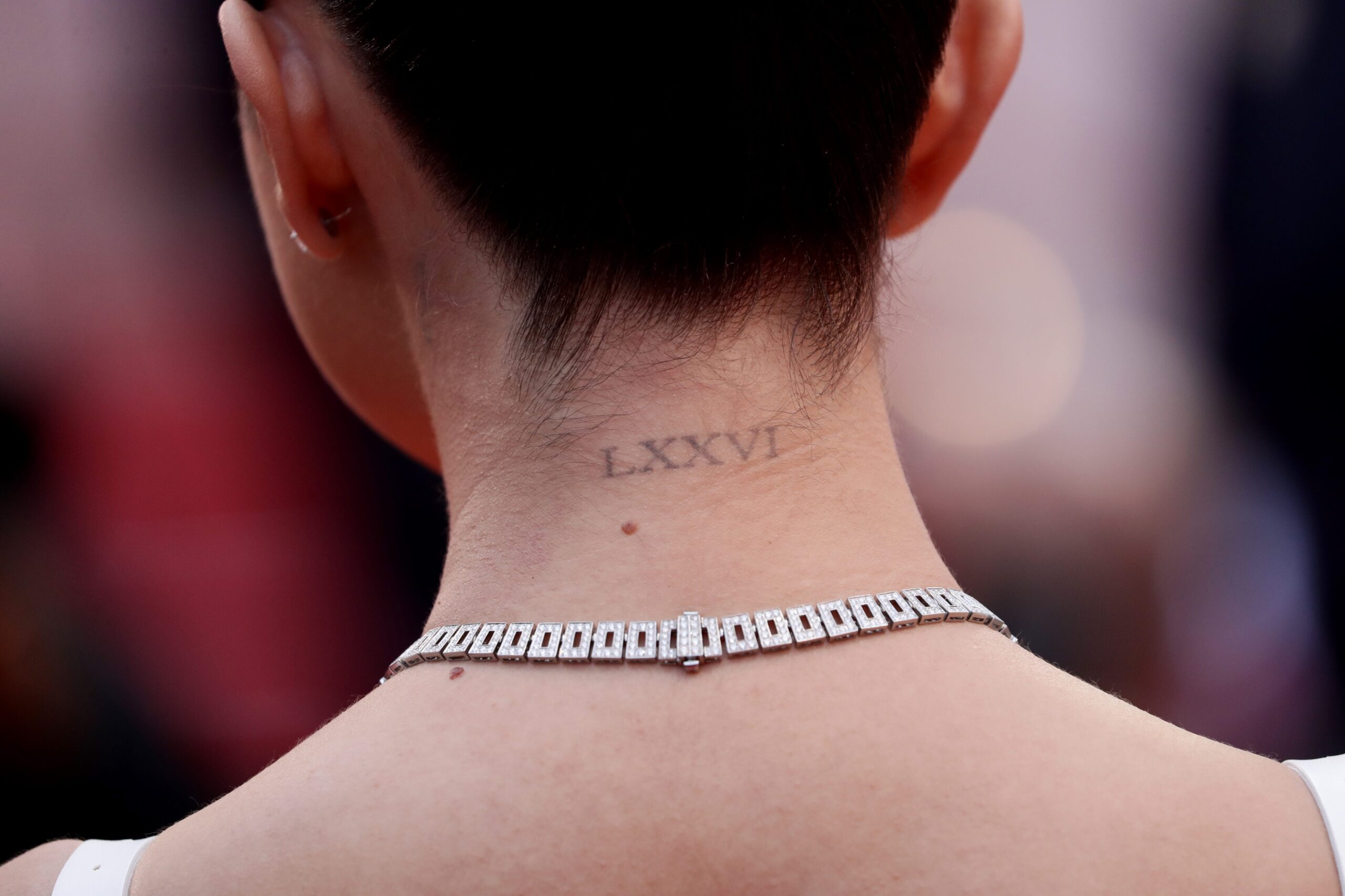 Selena Gomez’s LXXVI Roman numeral tattoo at the nape of her neck