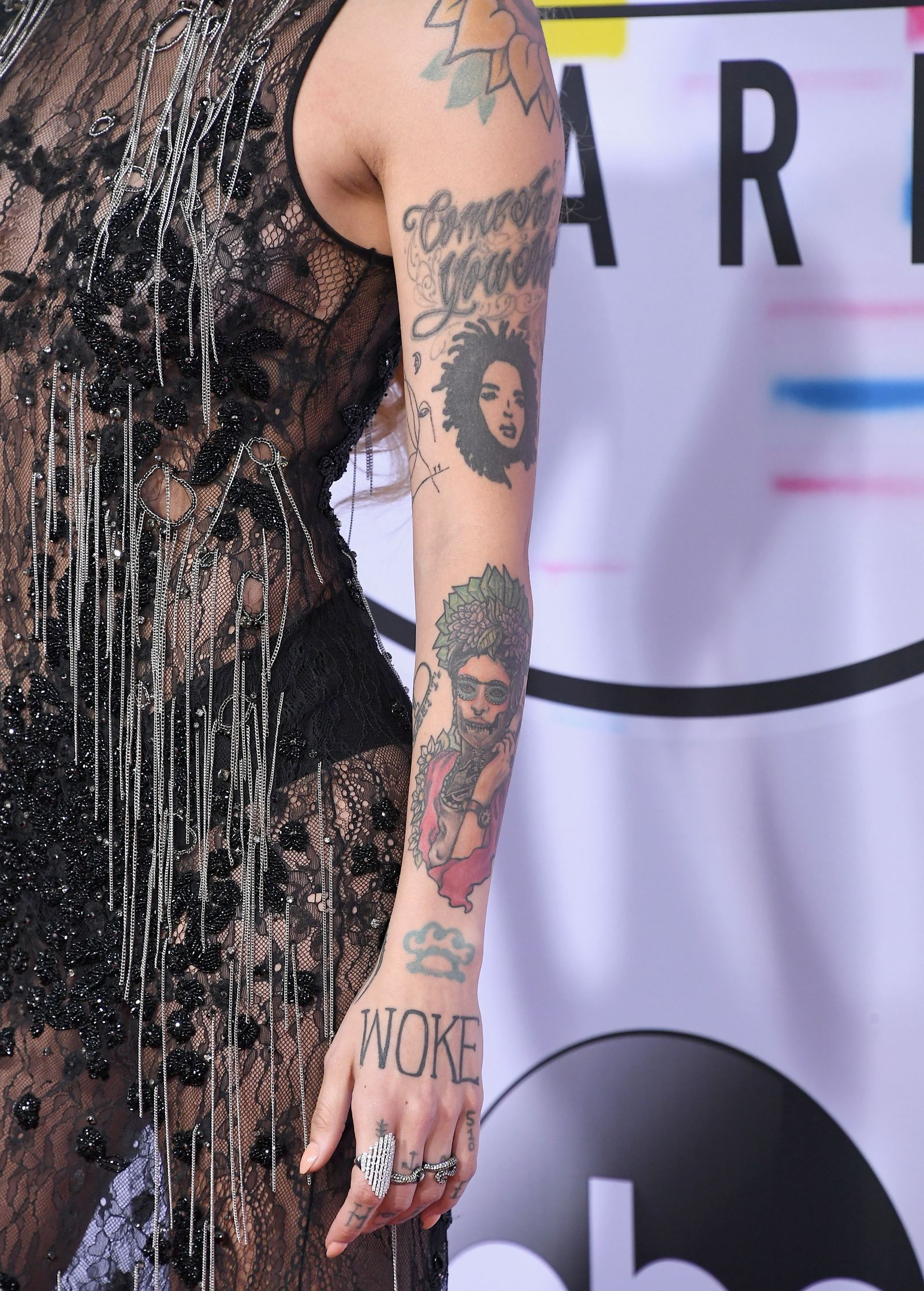 Kehlani tattoo detail showing hand and face ink