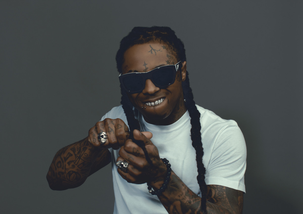 Lil Wayne’s tattooed forearms and hands in a Universal Music press portrait
