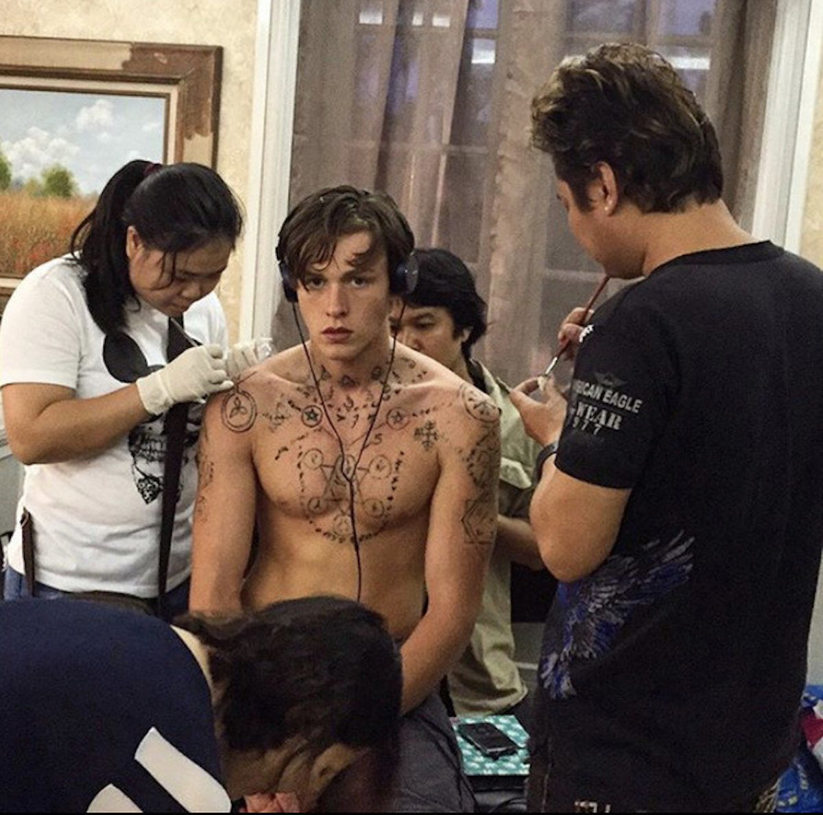 Harris Dickinson tattoos: Harris Dickinson tattoo session with chest and shoulder designs