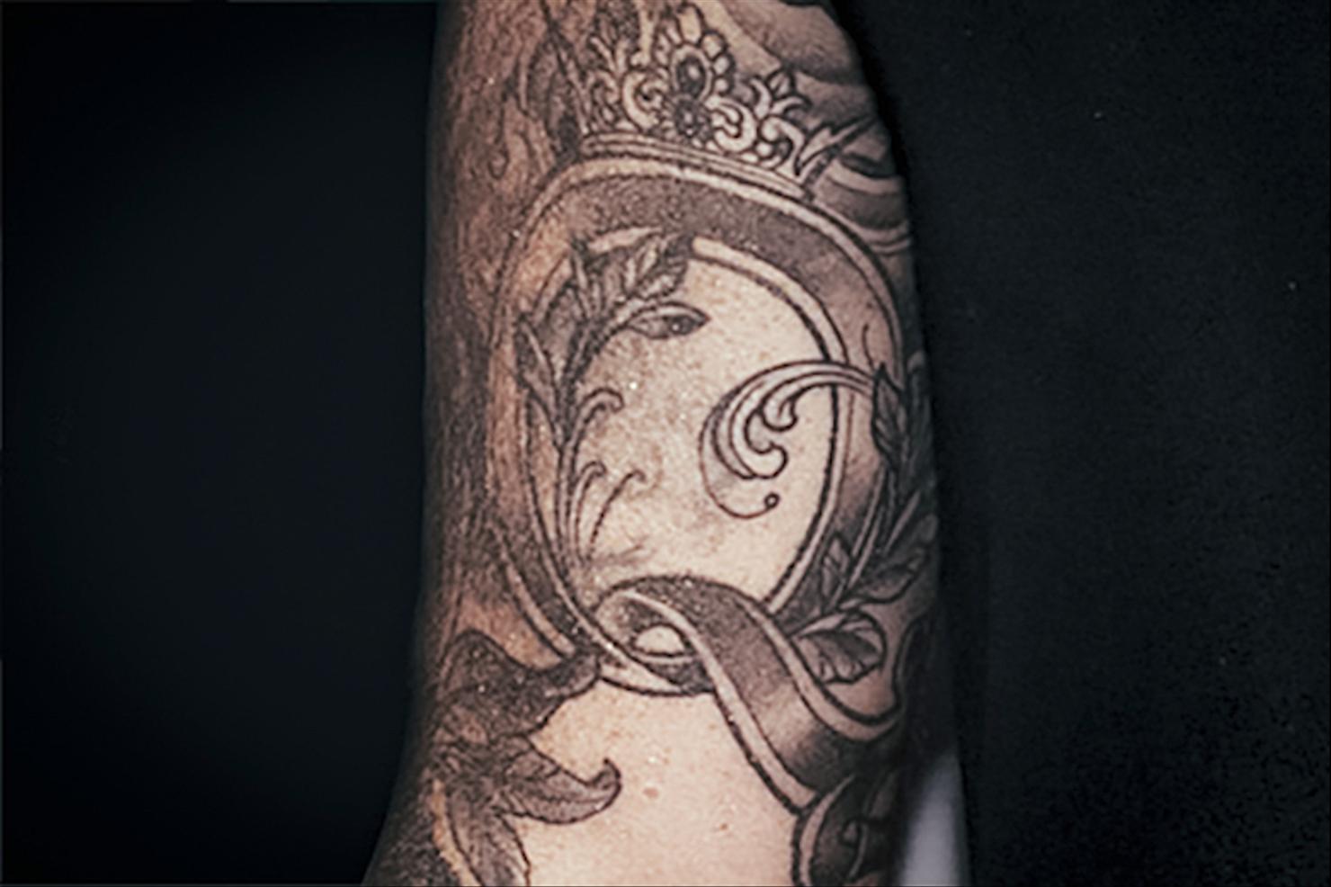 Adam Lambert baroque arm sleeve tattoo