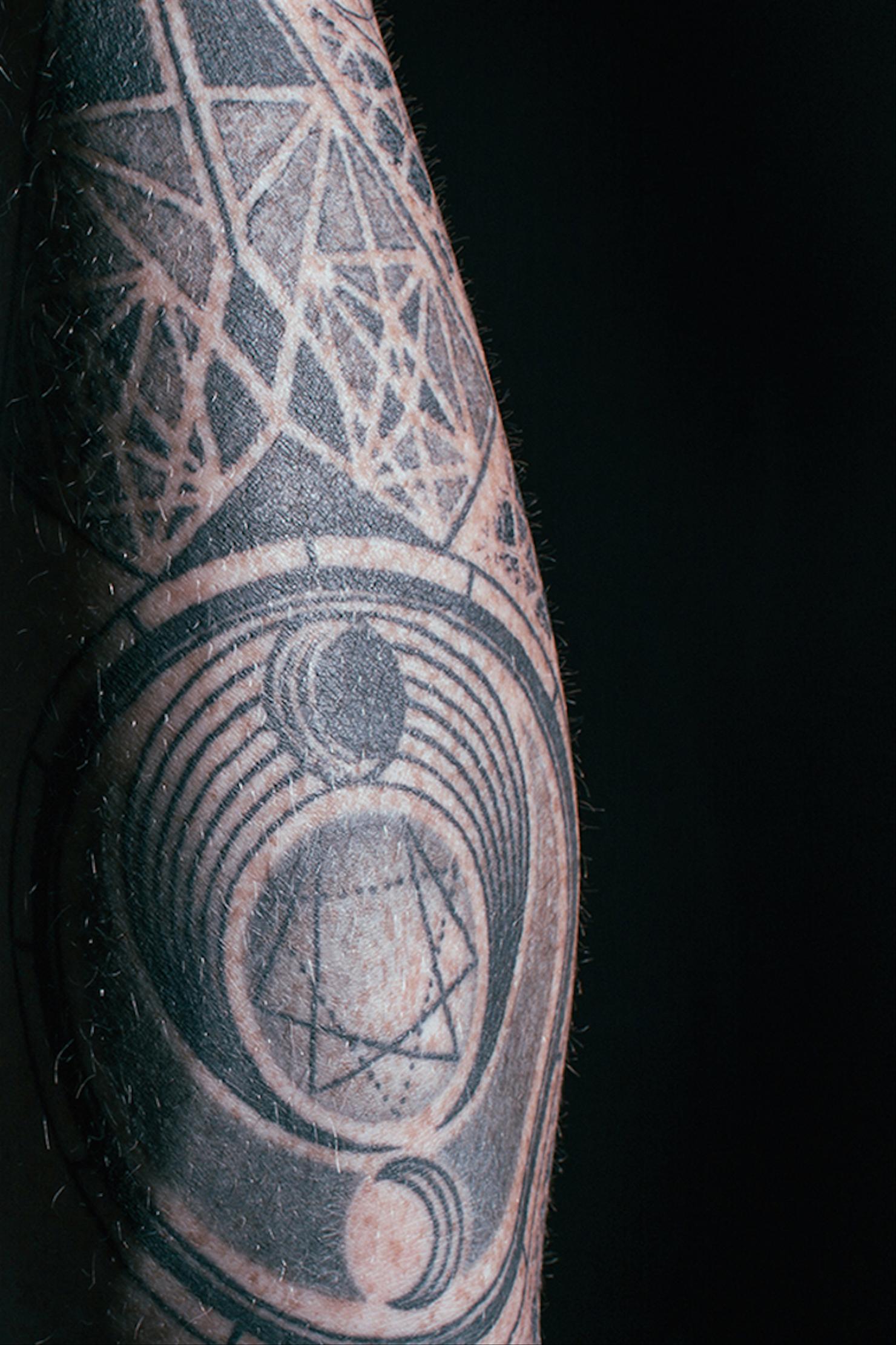 Adam Lambert Queen diamond geometric tattoo
