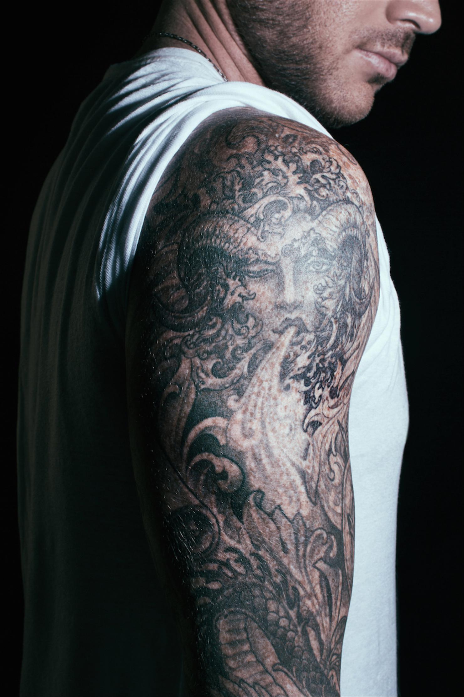 Adam Lambert Greek god arm sleeve tattoo