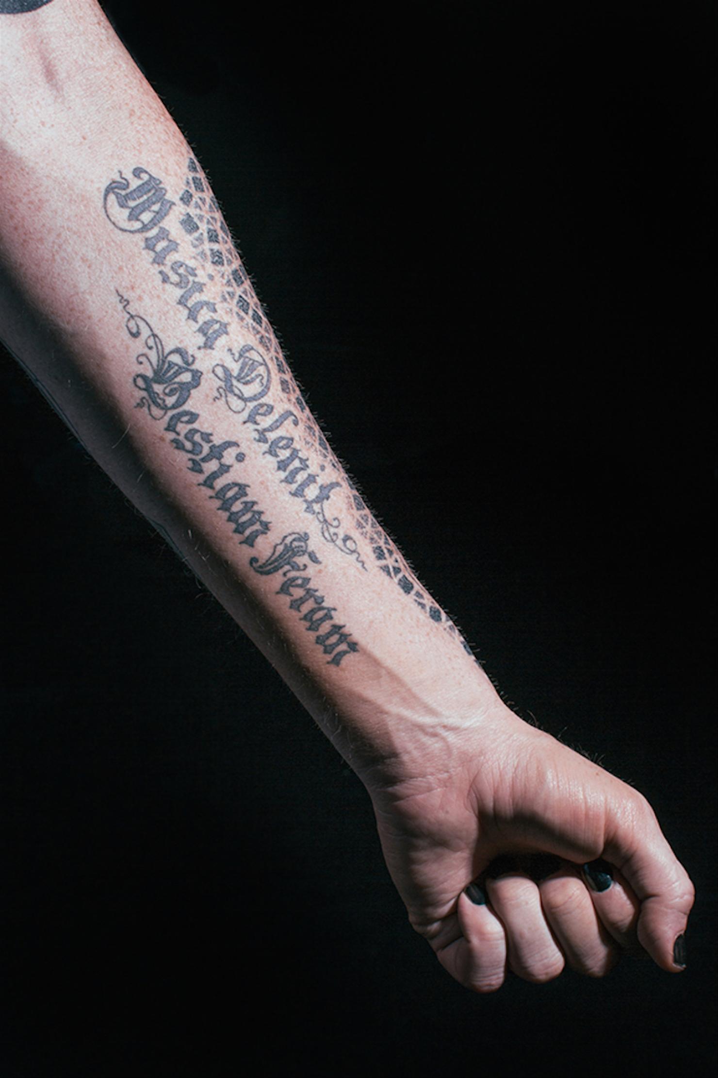 Adam Lambert Musica Delenit Bestiam Feram forearm tattoo