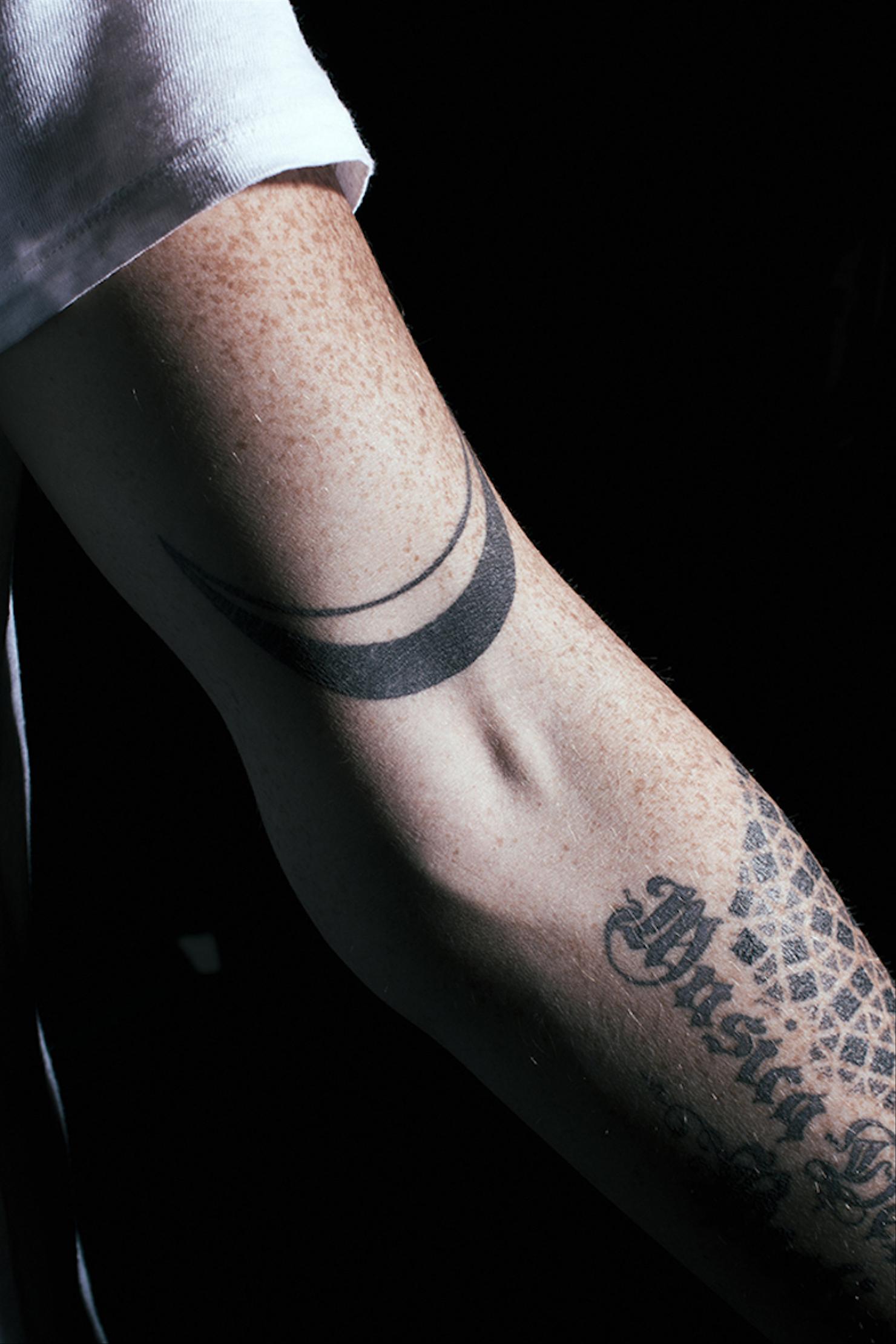 Adam Lambert Chasing the Original High collarbone tattoo
