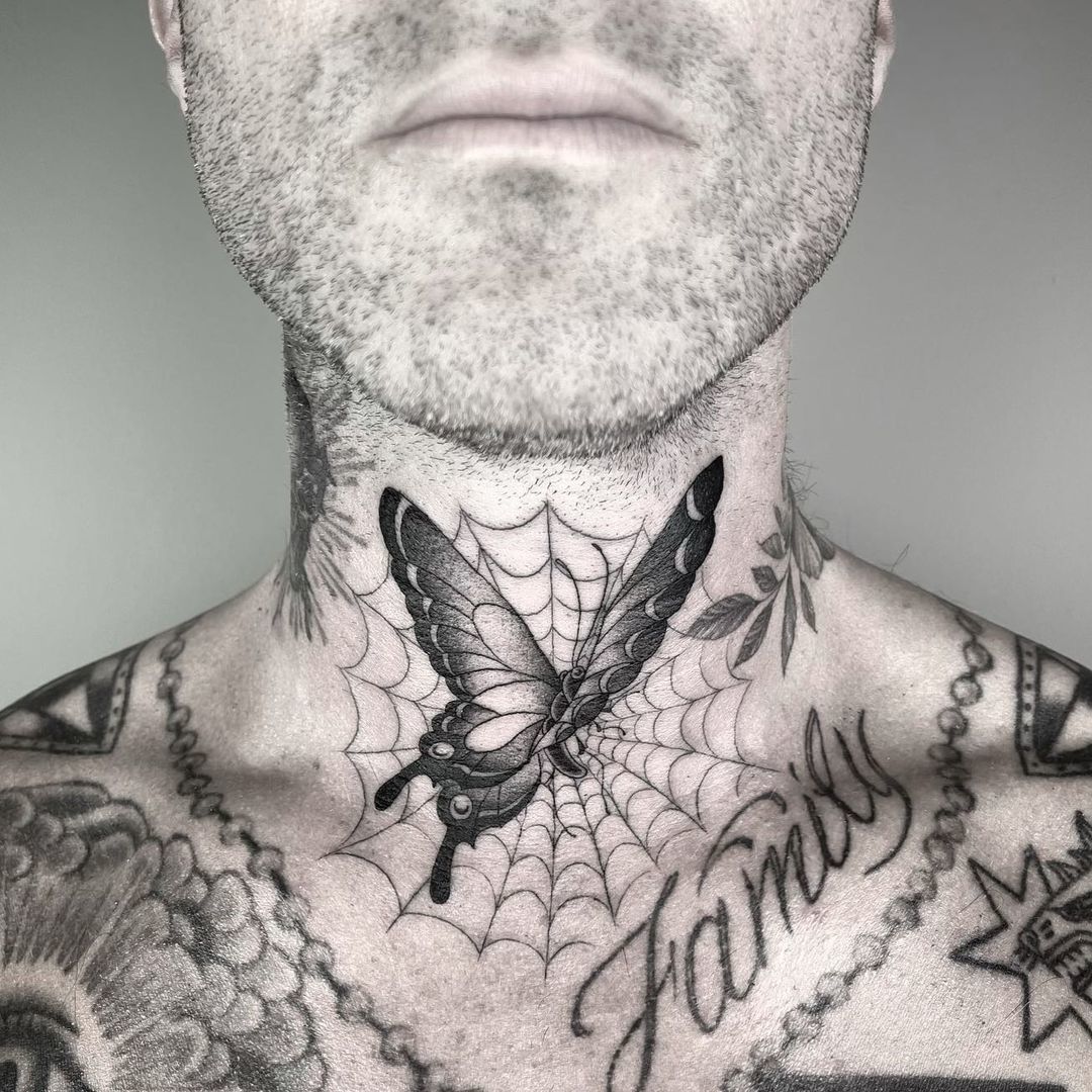 Adam Levine’s butterfly and spiderweb neck tattoo