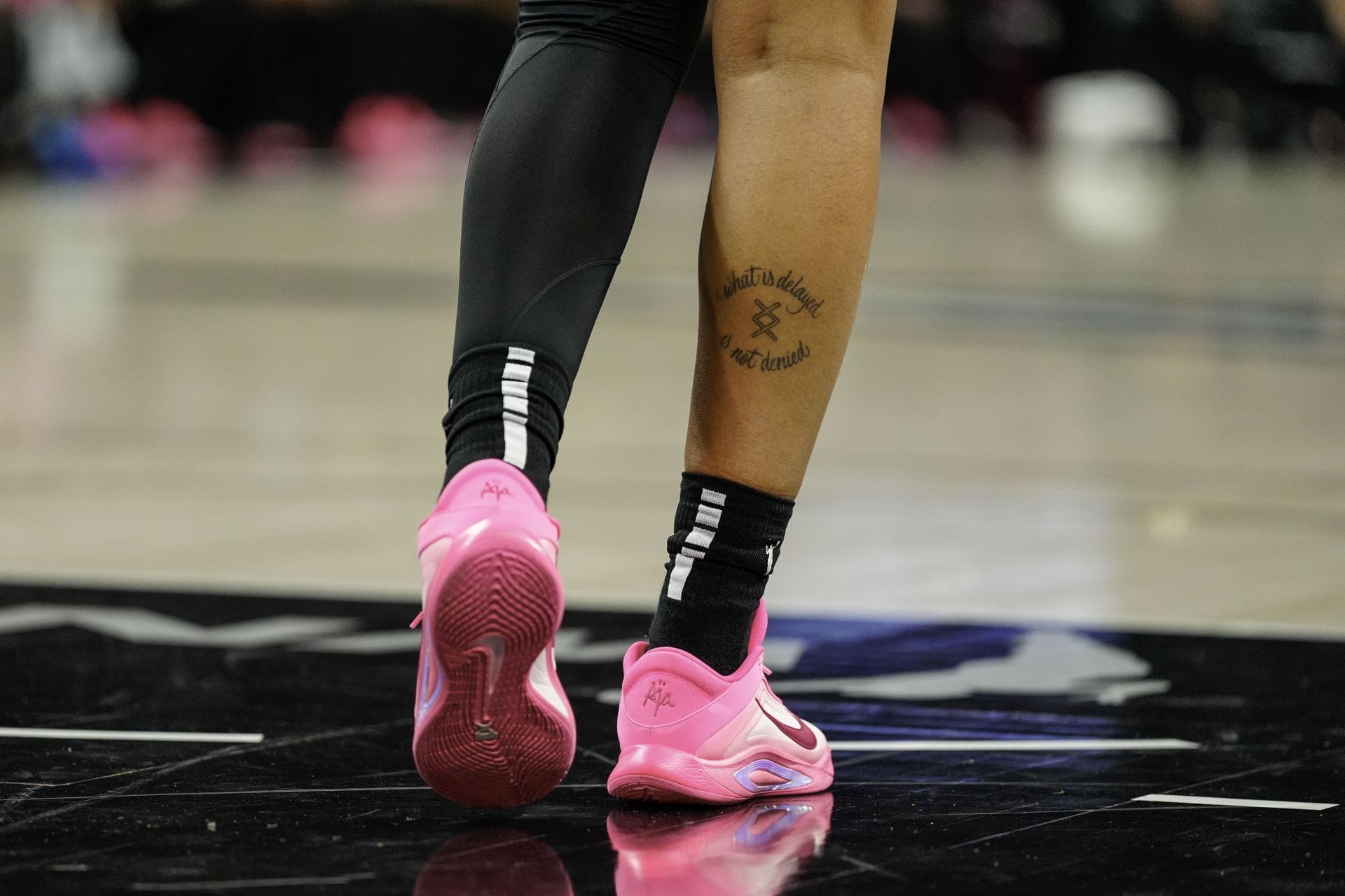 A’ja Wilson hustle hard thigh tattoo