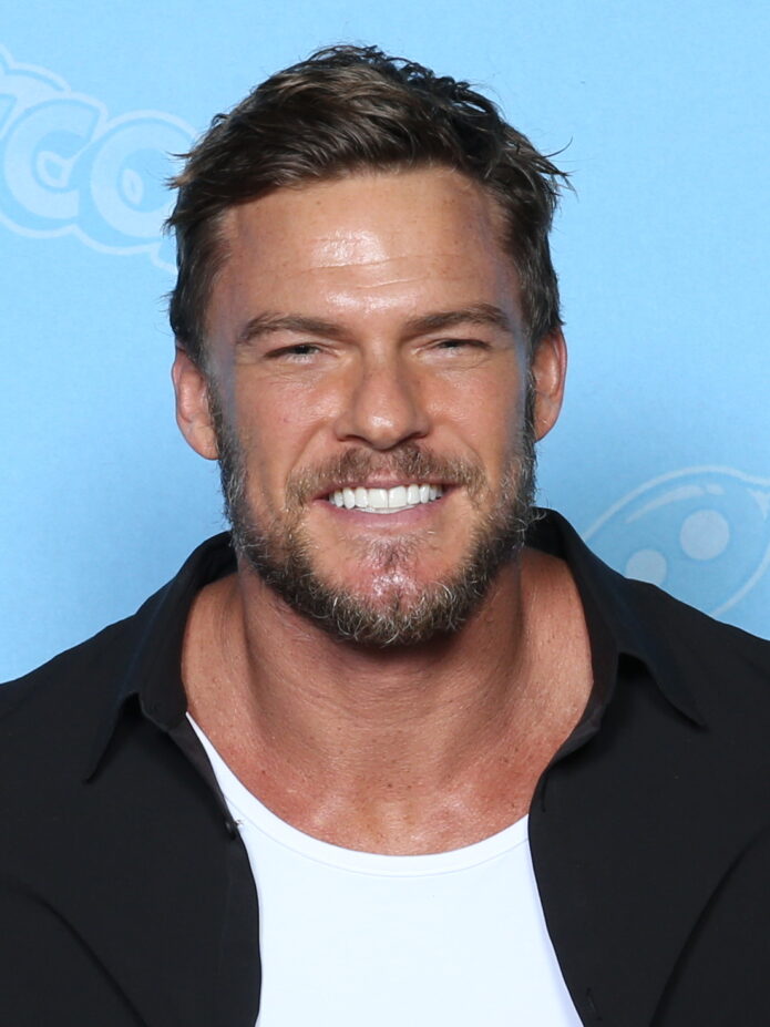 Alan Ritchson showing the large forearm project tattoo area
