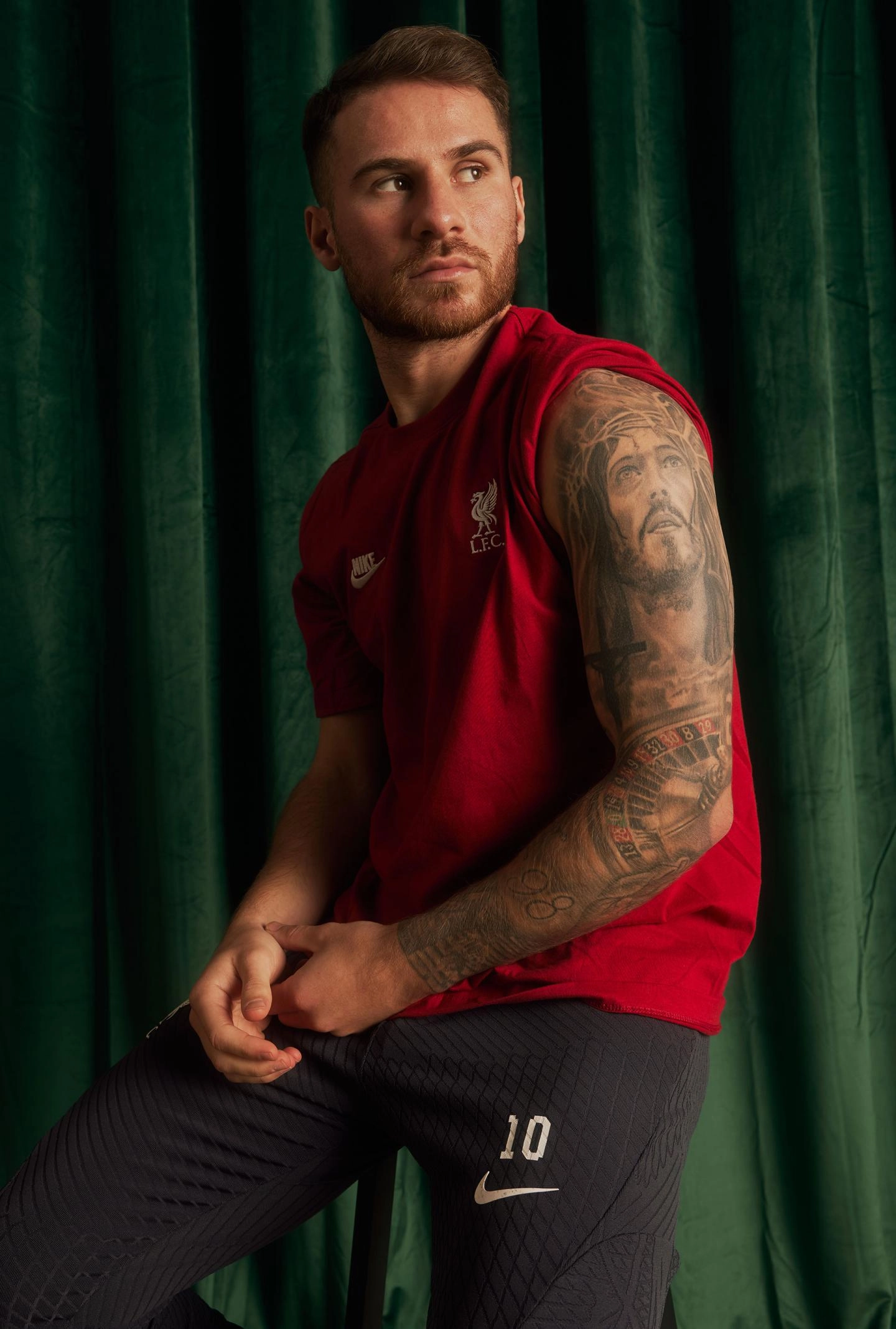 Alexis Mac Allister roulette wheel tattoo around his elbow