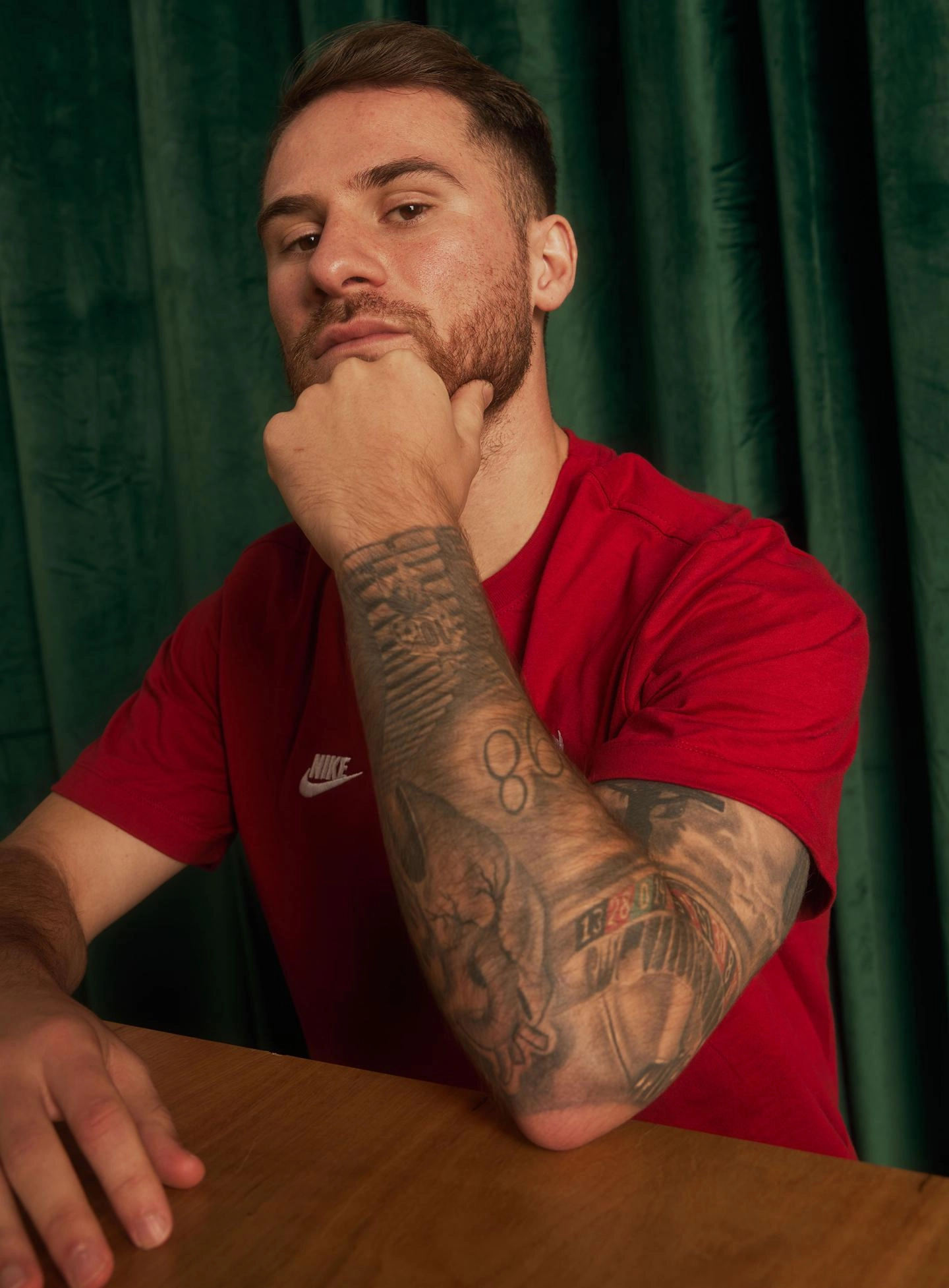 Alexis Mac Allister number 98 tattoo on his arm