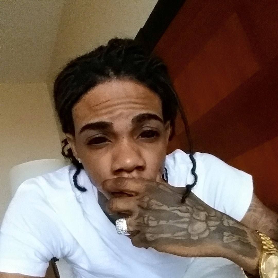Alkaline tattooed hand and eye tattoo