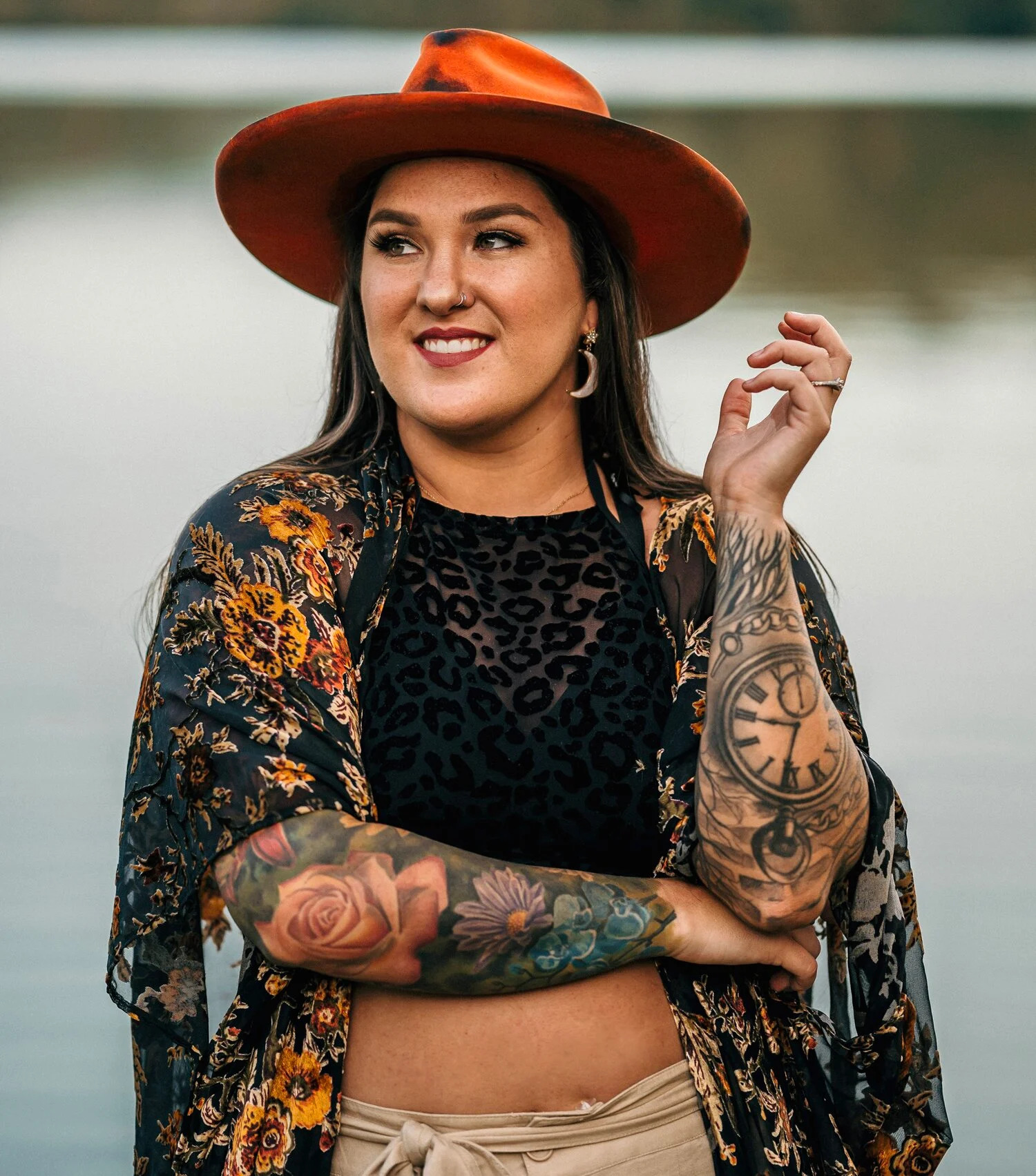 Allie Colleen pocket watch and rose tattoos on her arms