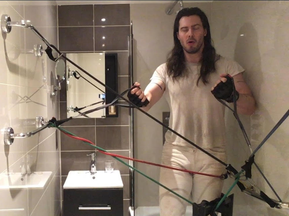 Andrew W.K. arm line tattoos in a mirror portrait