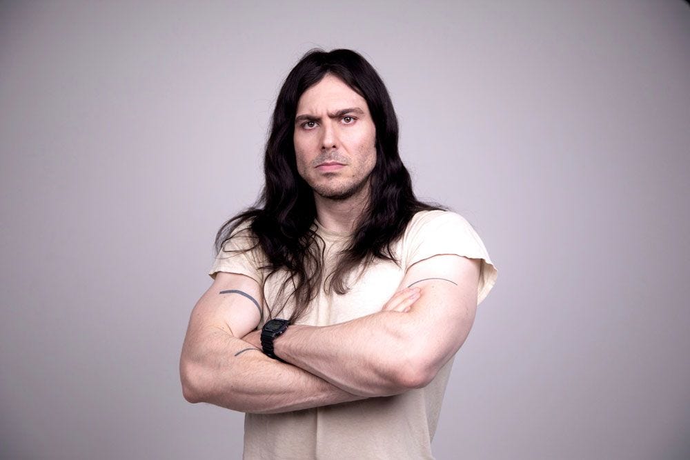 Andrew W.K. forearm line tattoos in a portrait