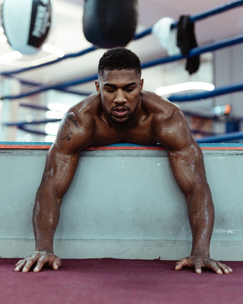 Anthony Joshua tattoos visible during boxing training