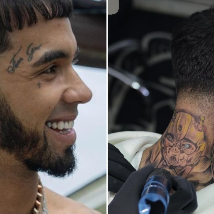 Anuel AA's hand and neck cover-up tattoos