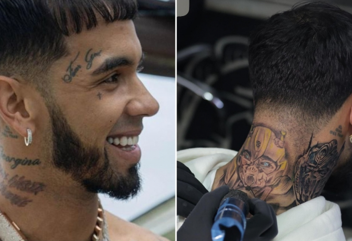 Anuel AA's hand and neck cover-up tattoos