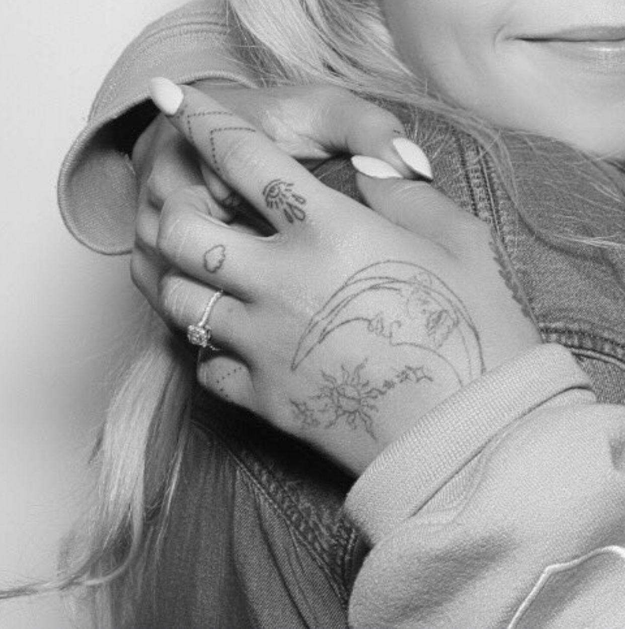 Ariana Grande sun moon and stars hand tattoos