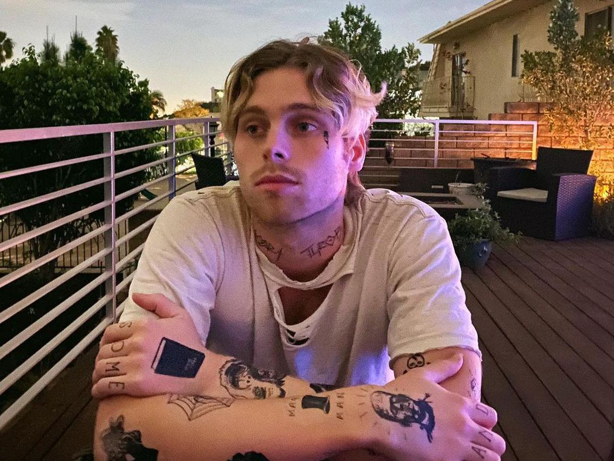 Luke Hemmings tattoos visible on his arm in portrait