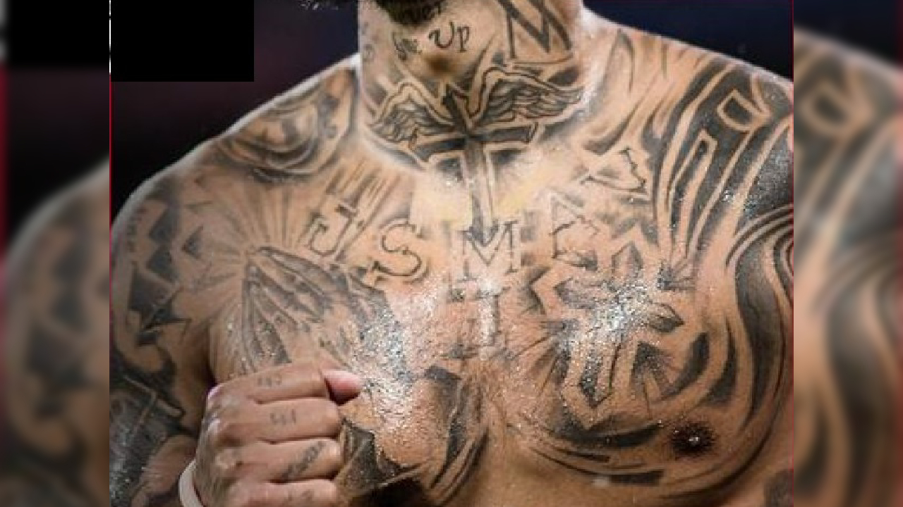 Arturo Vidal praying hands and cross chest tattoos