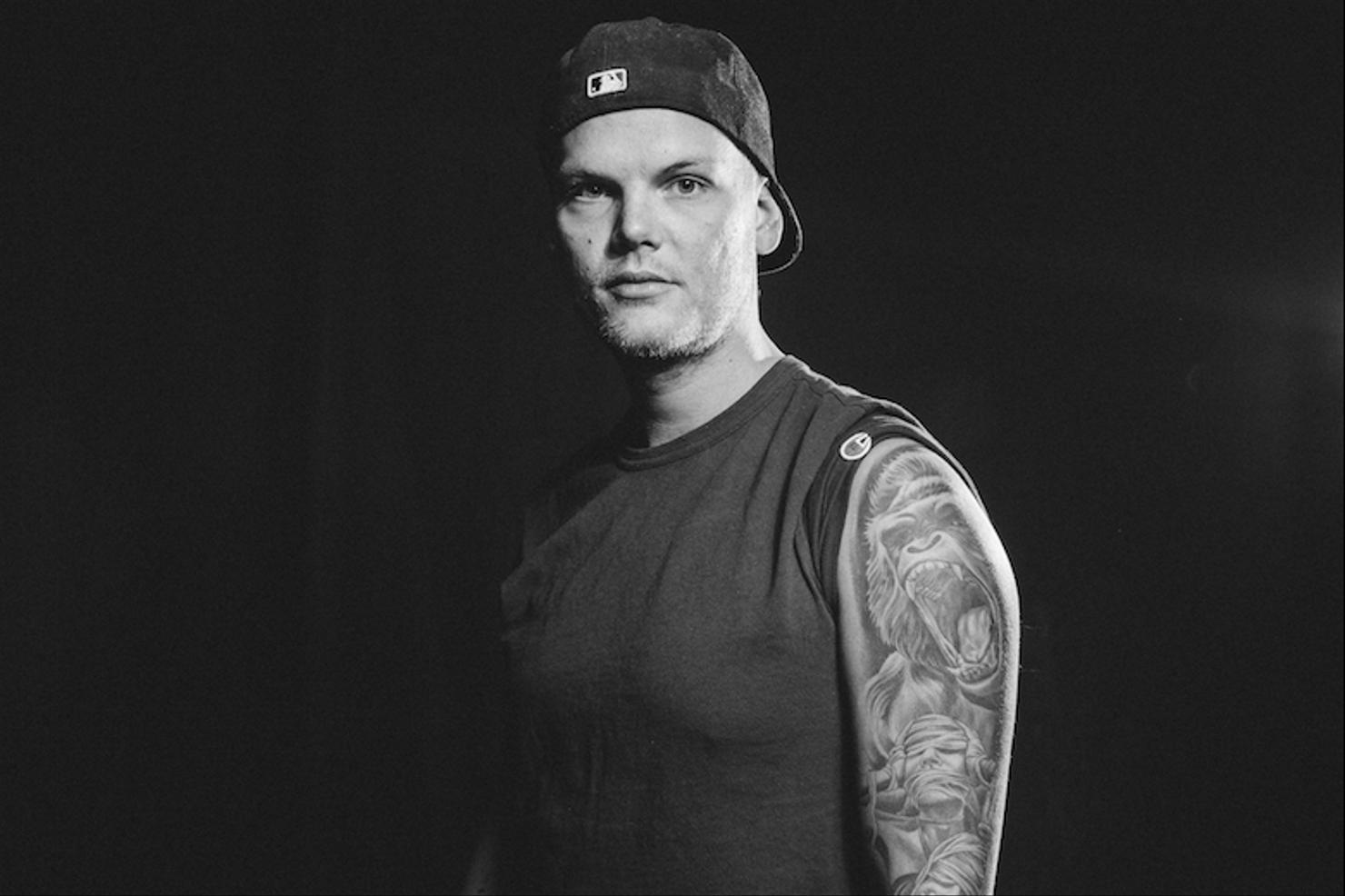 Avicii Banksy inspired right forearm tattoo