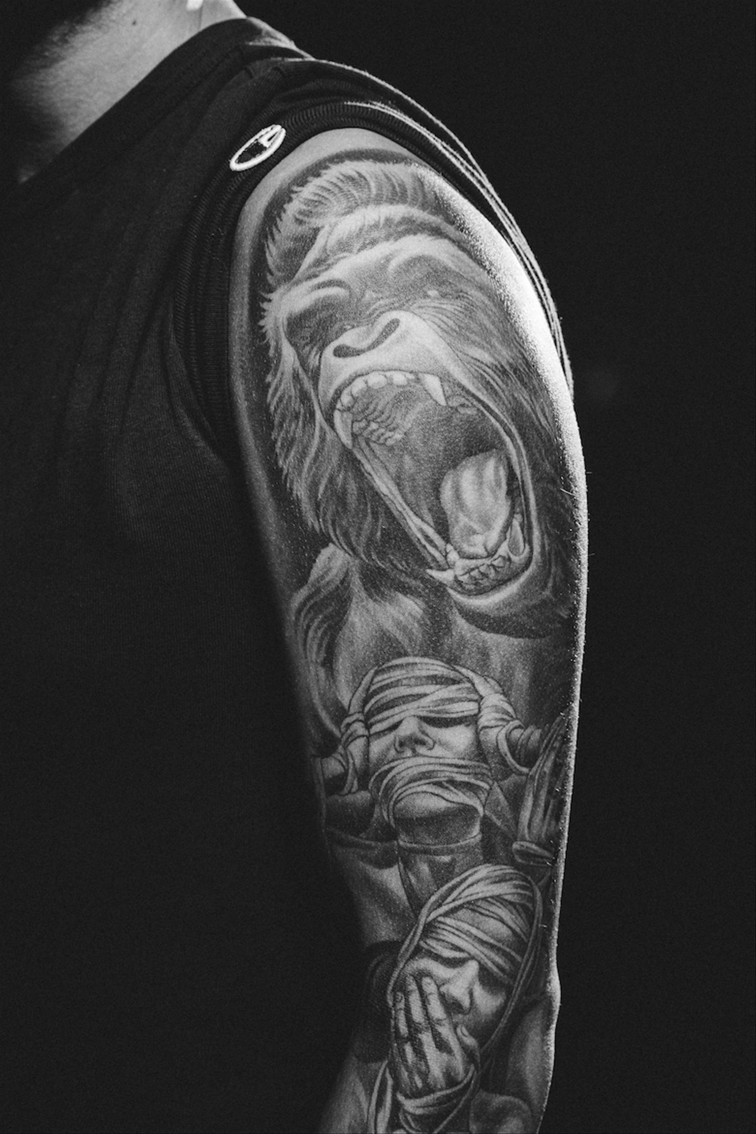 Avicii Greek sculpture forearm tattoo