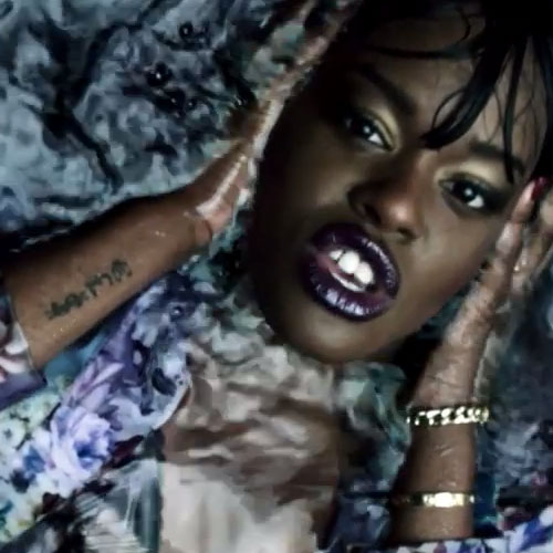 Azealia Banks currency symbols wrist tattoo