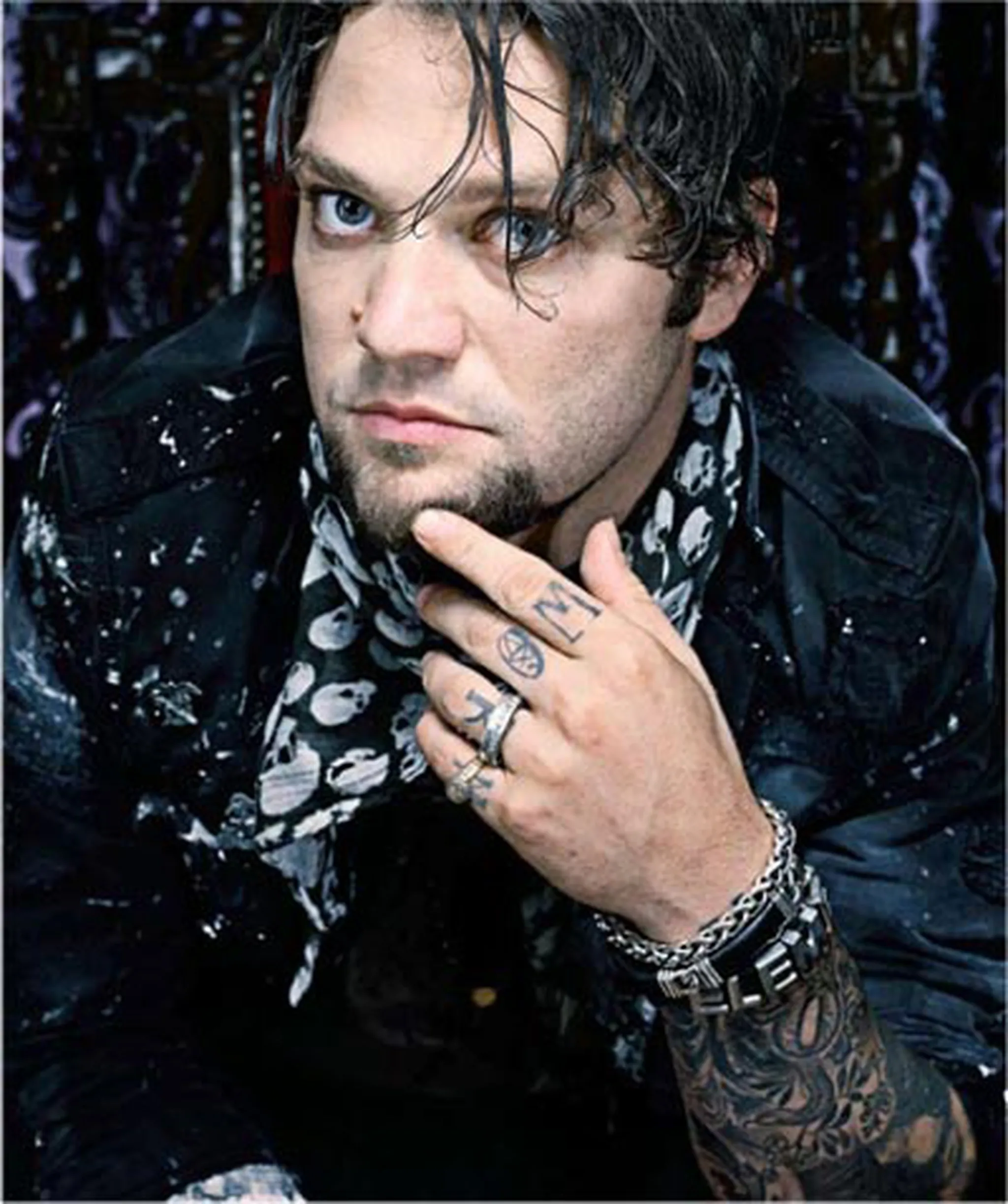 Bam Margera hand and arm tattoos in a close portrait