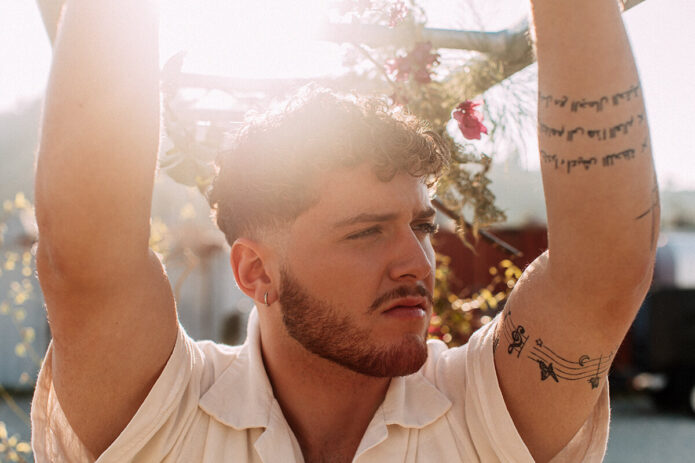 Bazzi Arabic and musical arm tattoos
