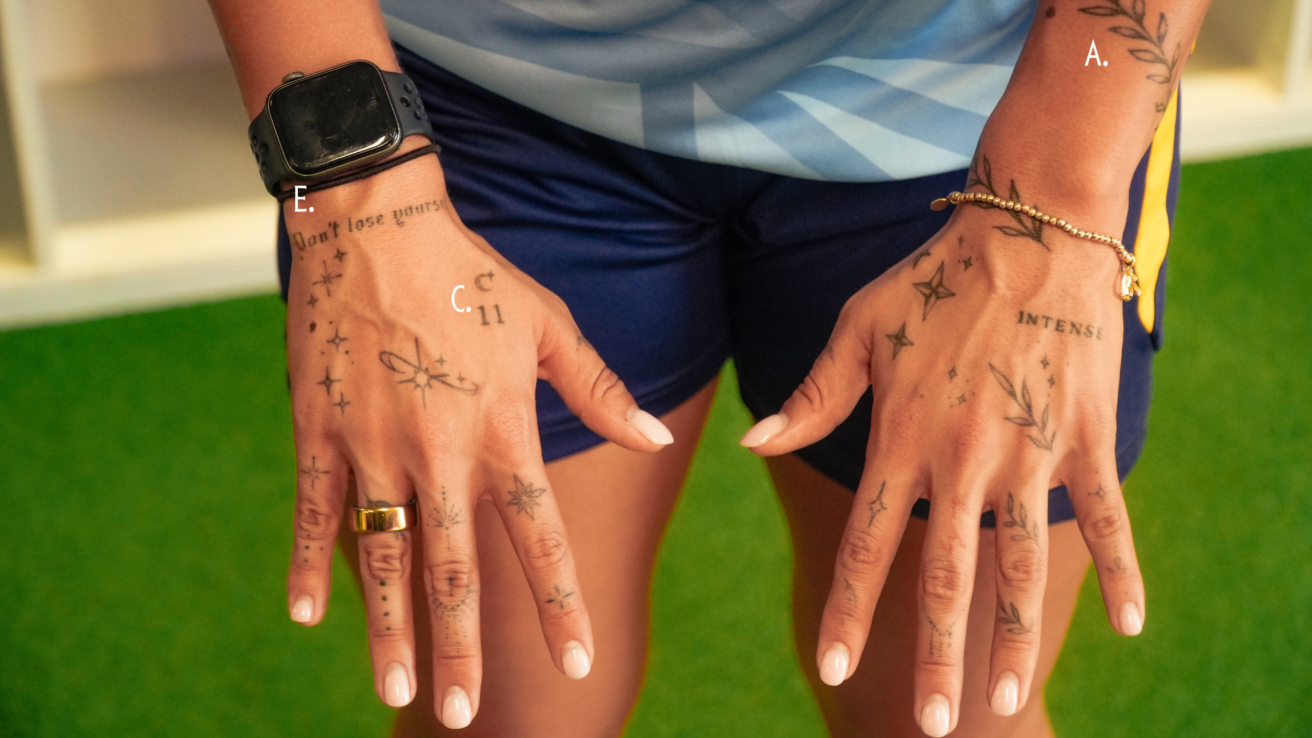 Becca Teale vine tattoos across both hands