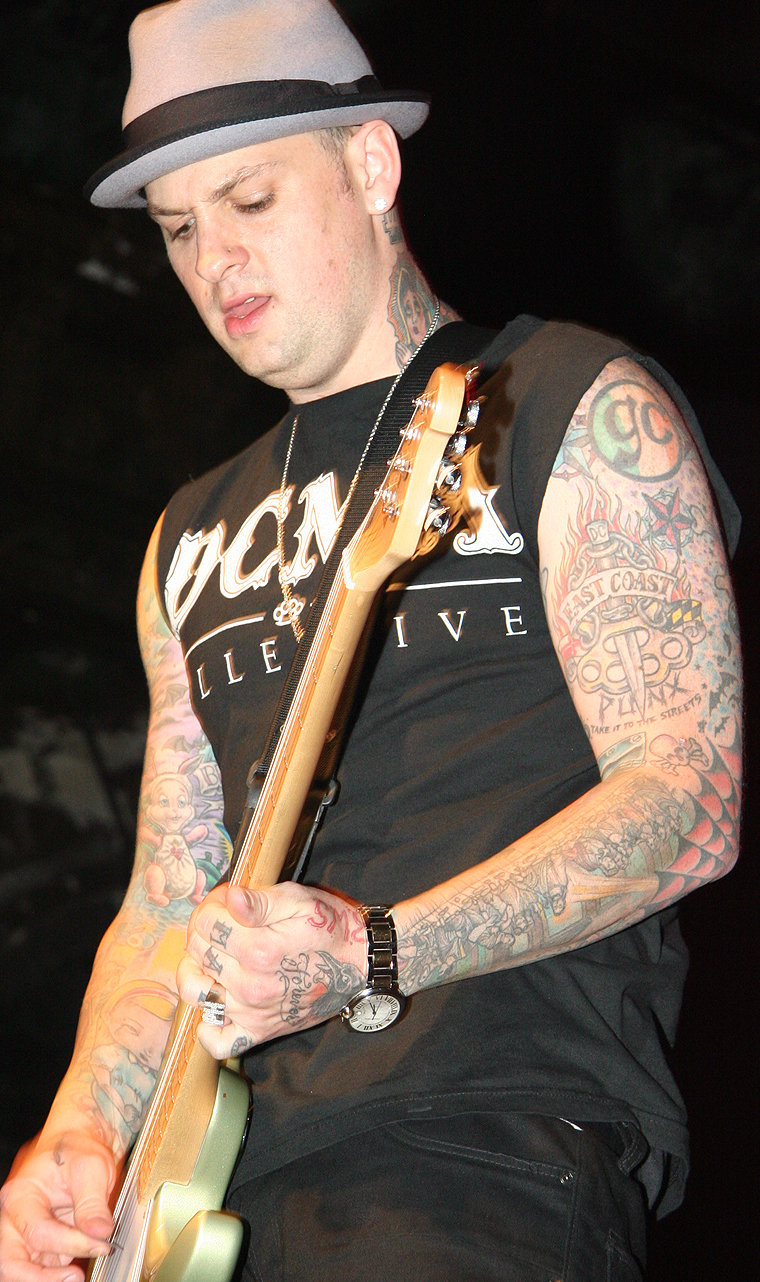 Benji Madden tattooed arm while playing guitar