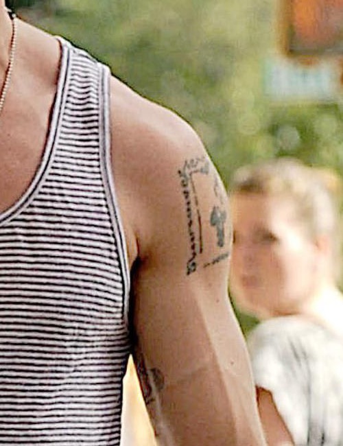 Ryan Gosling’s inner-arm tattoo of a woman beside a skeleton