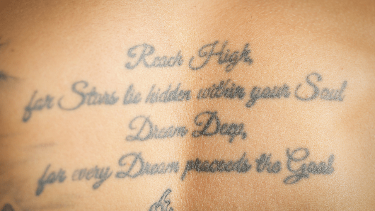 Brandon Montour motivational upper back quote tattoo