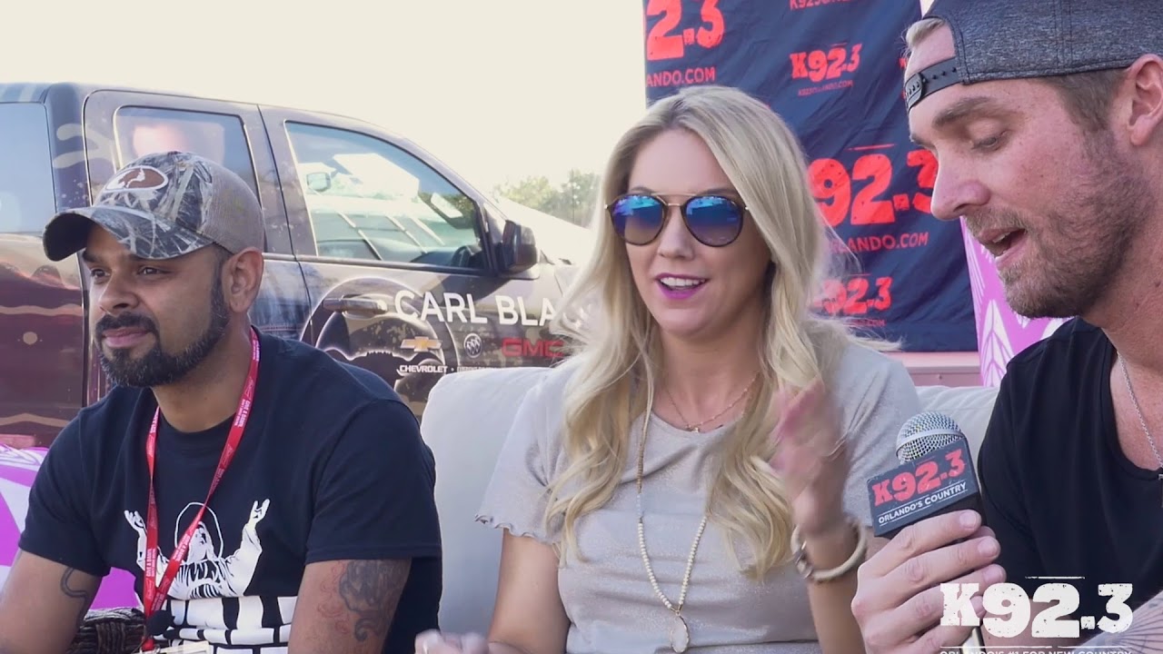 Brett Young showing small ring finger and hand tattoos