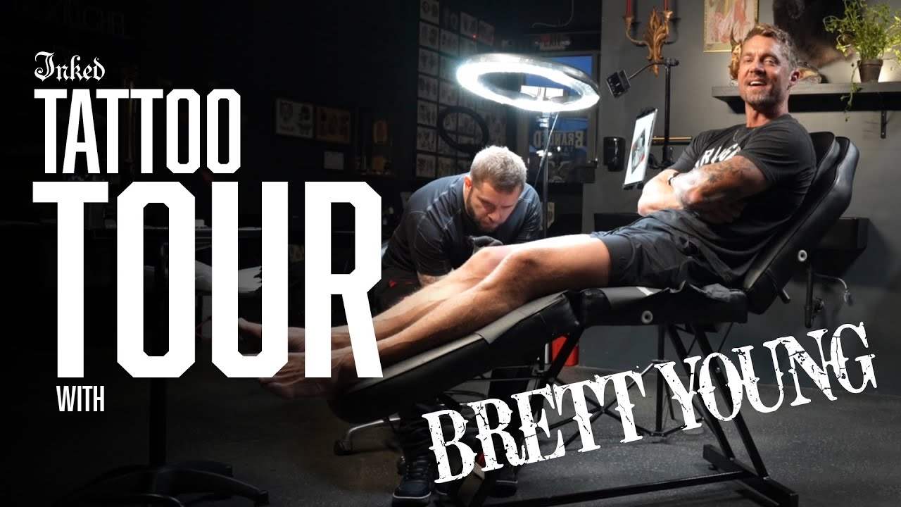 Brett Young showing the Where words fail tattoo on his arm during a tattoo tour