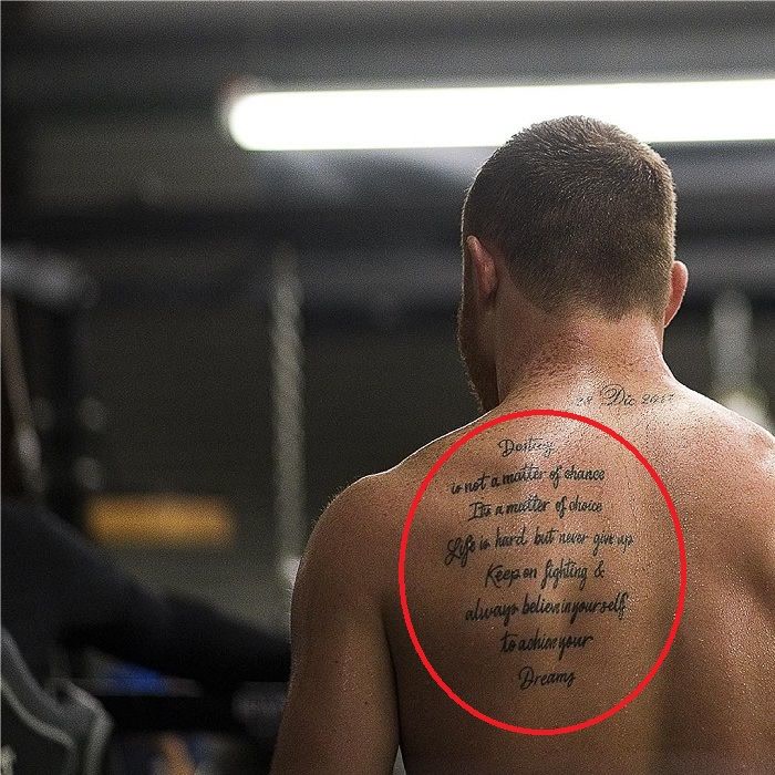 Canelo Alvarez quote tattoo across his back