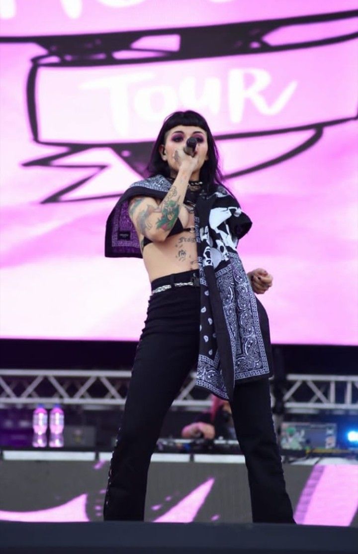Cazzu arm and torso tattoos