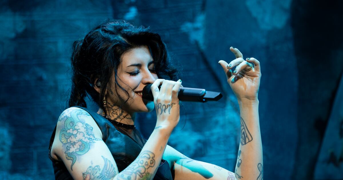 Cazzu live tattoos across her arms and torso