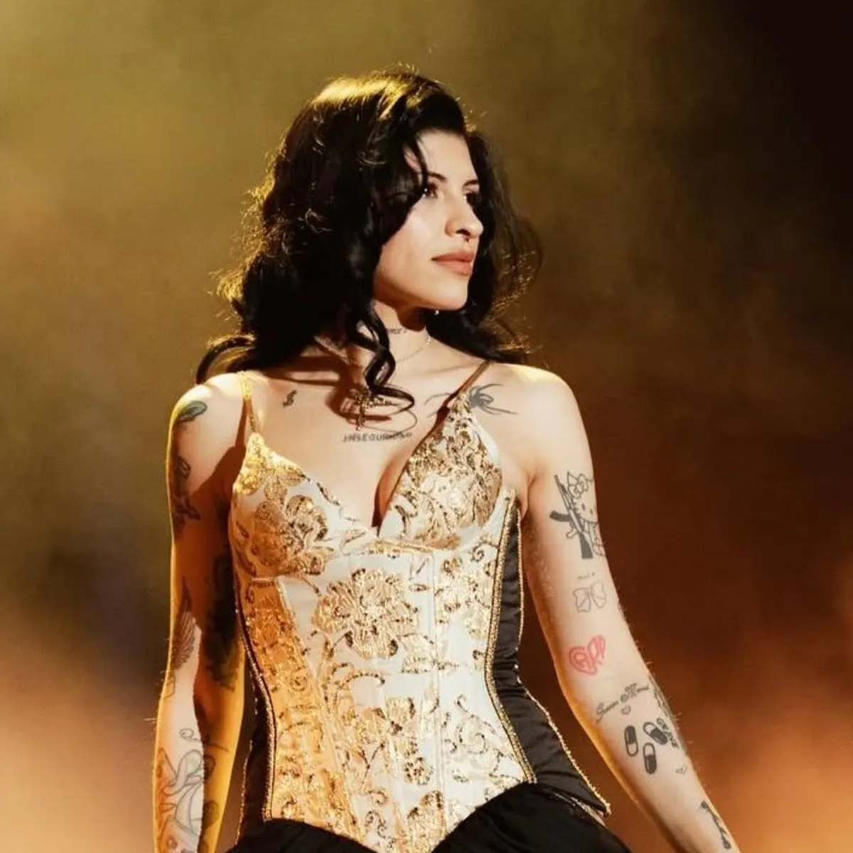 Cazzu stage arm tattoos