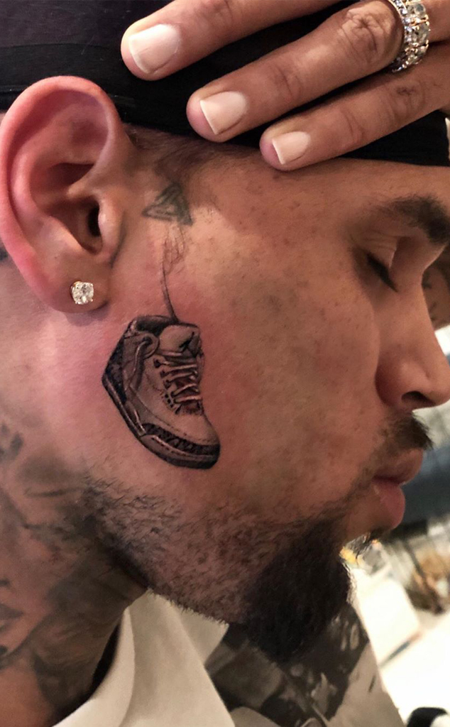 Close-up of Chris Brown's Air Jordan sneaker tattoo on the right side of his face