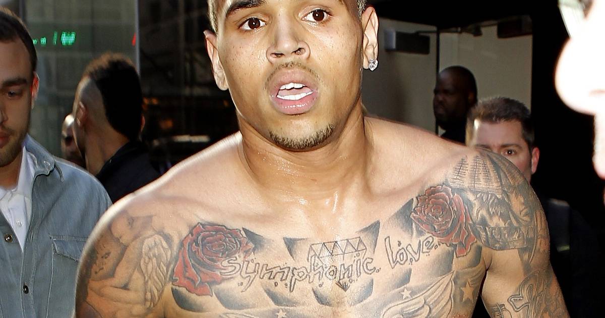 Chris Brown's Symphonic Love lettering, roses, and wings across his chest
