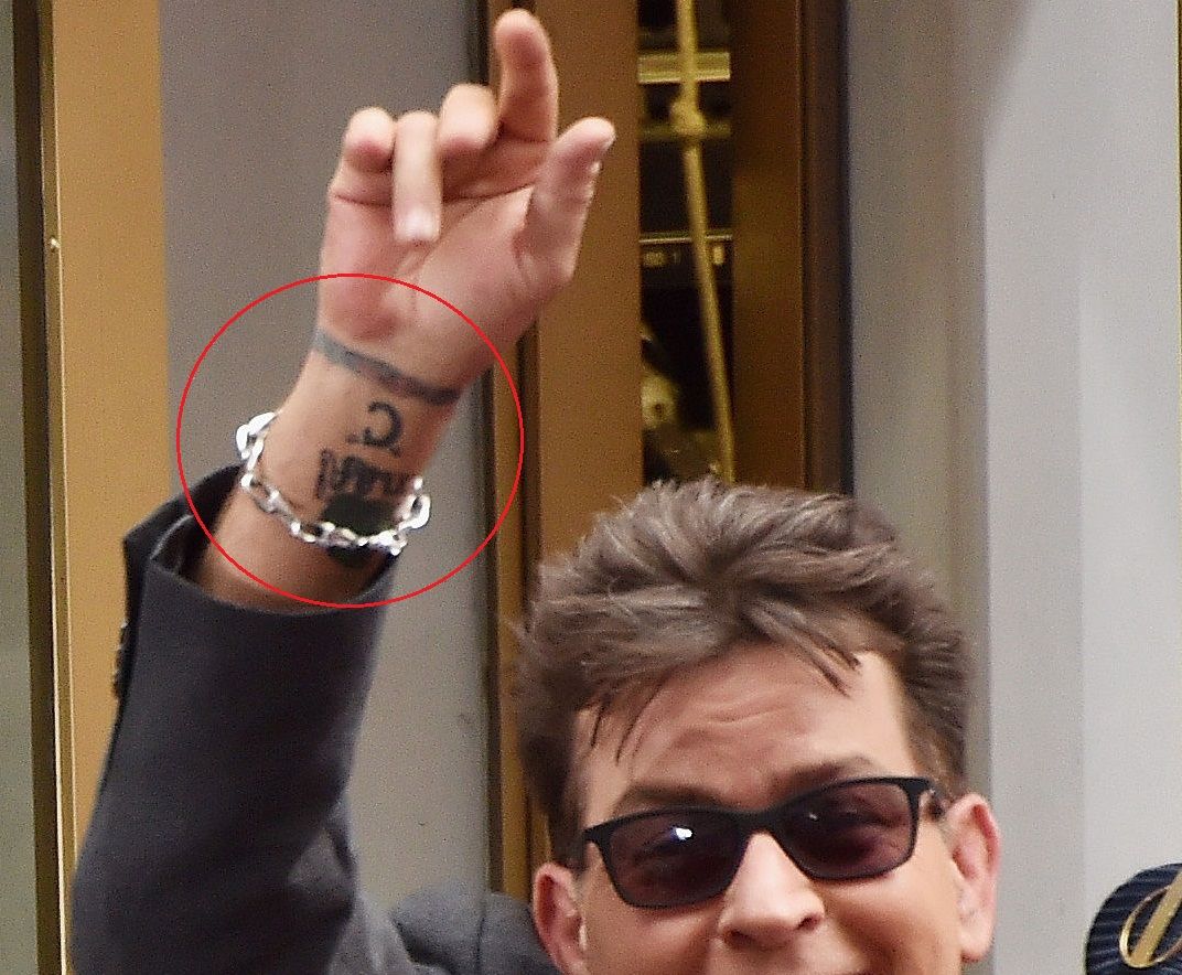 Charlie Sheen C wrist tattoo