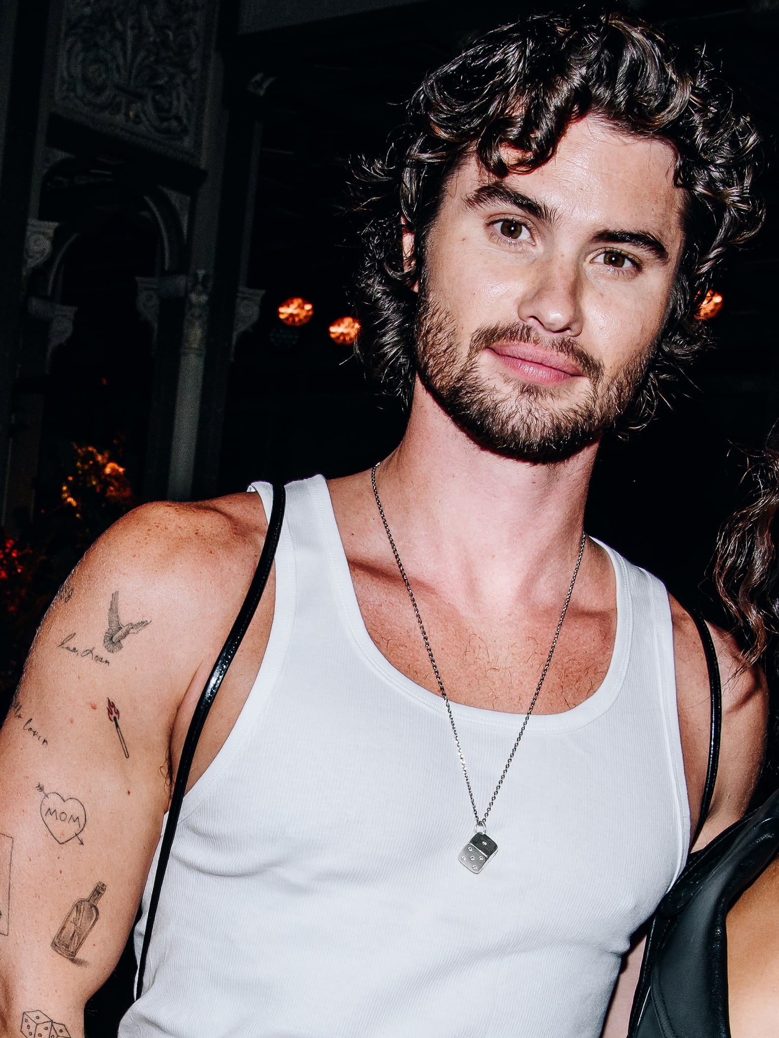 Chase Stokes matchstick and arm tattoos