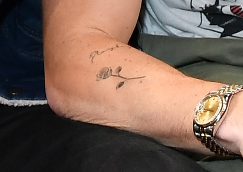 Chase Stokes rose arm tattoo