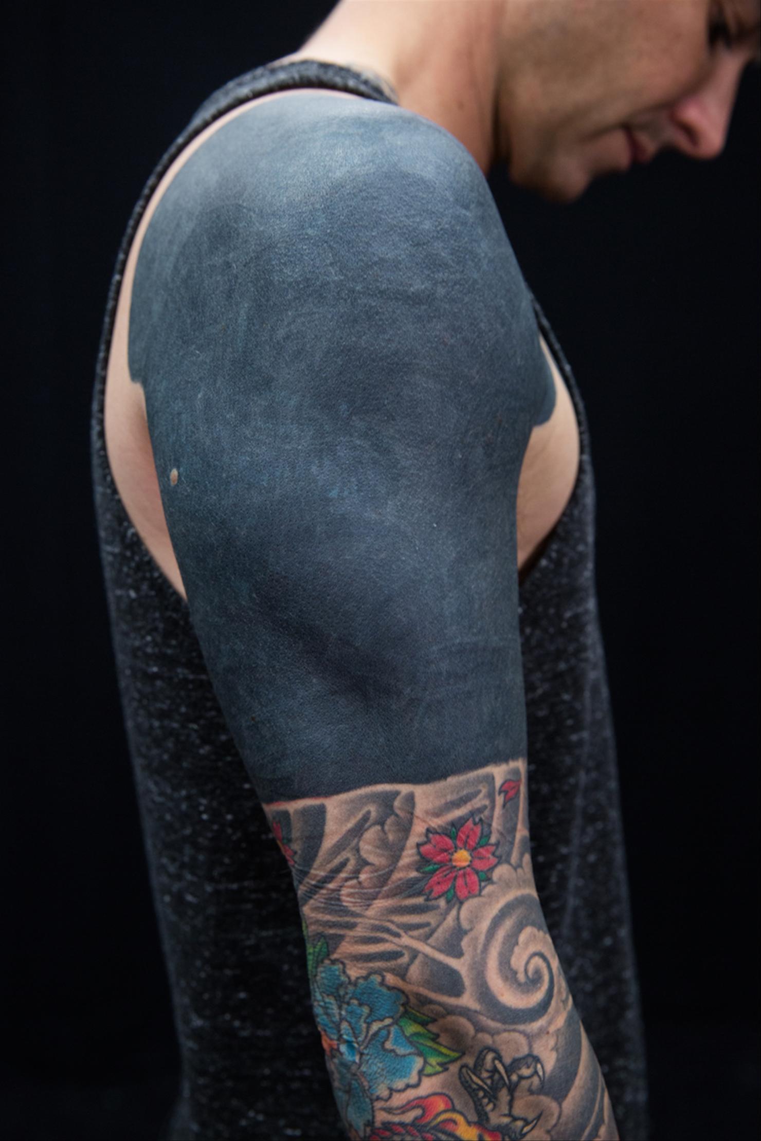 Chris Carrabba blacked-out arm band tattoo