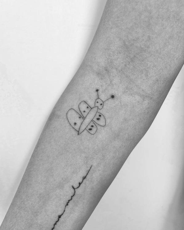 Chrissy Teigen butterfly tattoo drawn by Luna