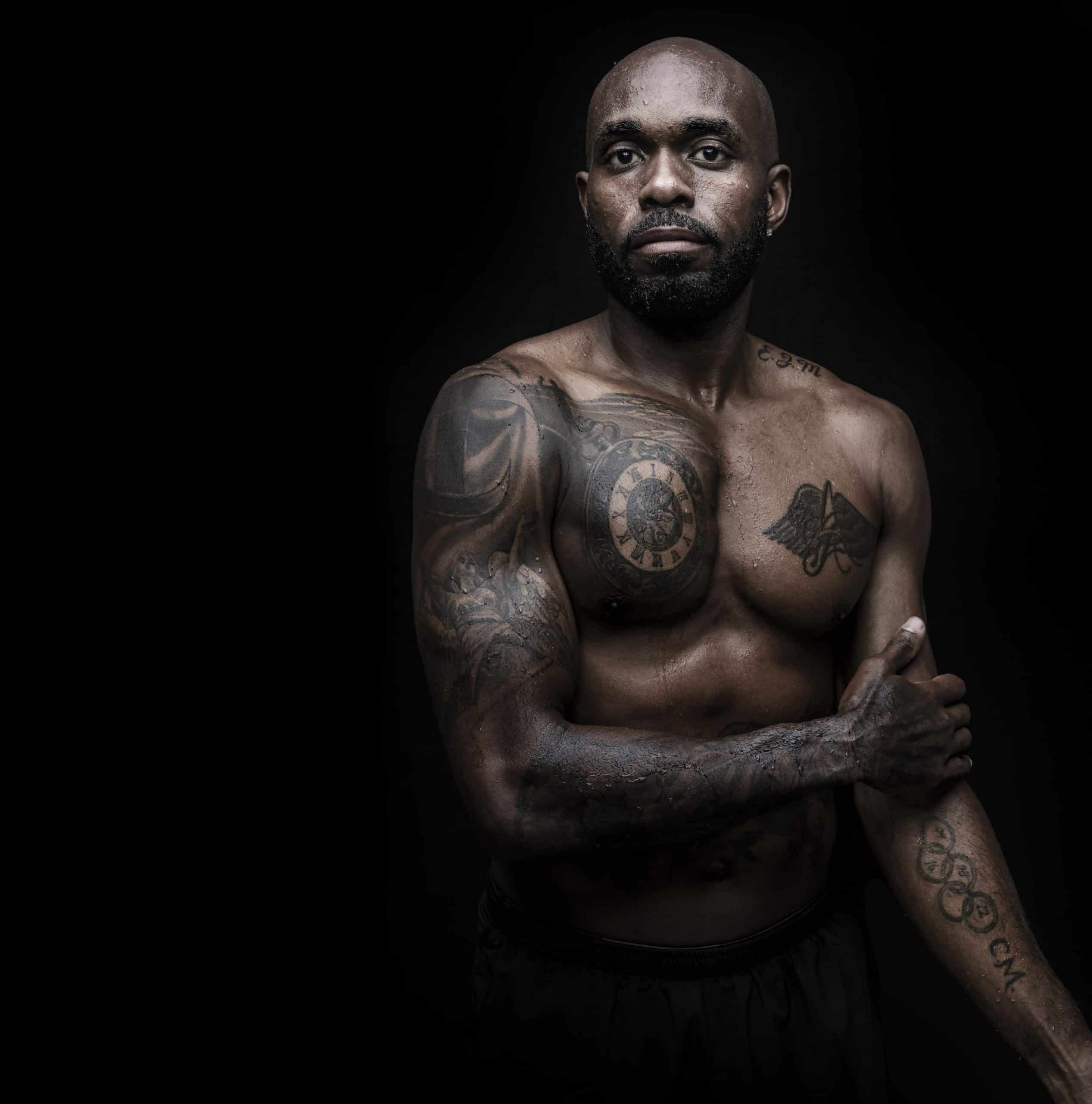 Churandy Martina chest and Olympic rings tattoos